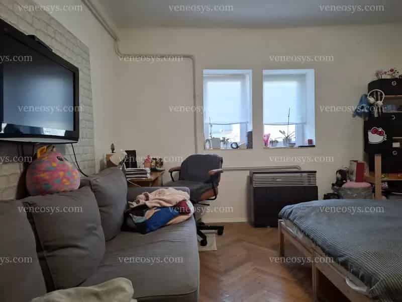 Budaörs szívében, mégis csendes helyen kis lakás kis kerttel eladó!